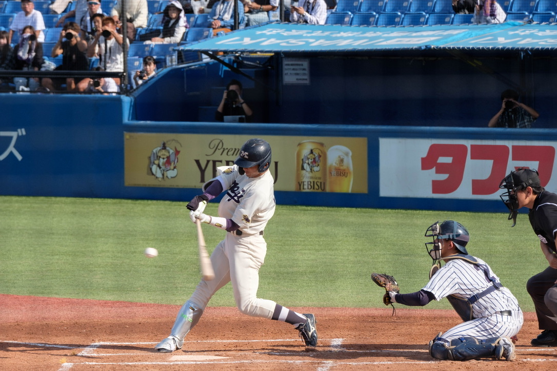 A batter making contact with the ball