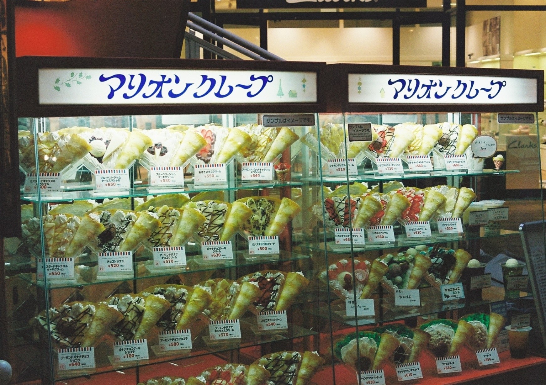 A colorful display of crepes in a shop window